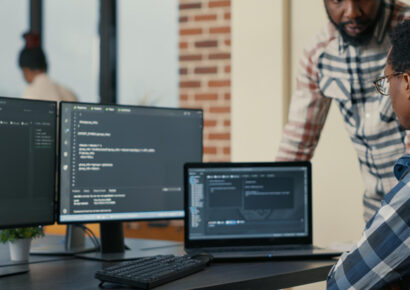 33386 Two developers collaborating on a coding project.